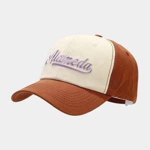 Detail of Alameda purple embroidery on contrast brown and beige baseball cap