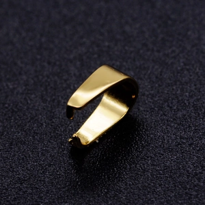 Polished gold stainless steel pinch bail connector for DIY jewelry making on black background