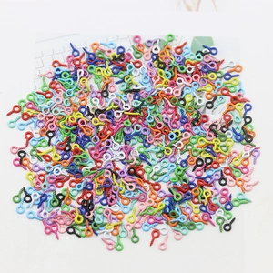 Macro shot of colorful metal eyelet screw pins for DIY jewelry and Christmas ornaments