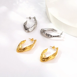 Irregular C-shaped geometric stainless steel earrings in gold and silver finishes