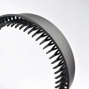 Macro shot of non-slip inner teeth on black matte plastic headband for hair grip