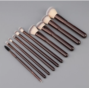Macro shot of 10-piece makeup brush set with coffee-colored handles and soft fiber bristles