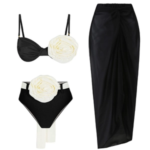 Three-piece bikini set featuring 3D white rose detail and high-waist wrap skirt