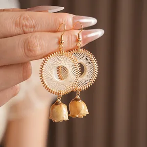 Handmade woven circular earrings with real dried flower pendants and gold hooks