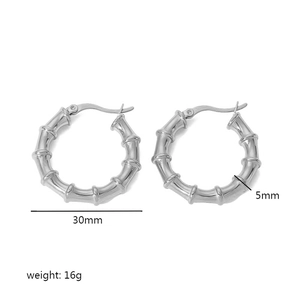 Detailed view of silver bamboo-style hoop earrings showing 30mm diameter and 5mm width