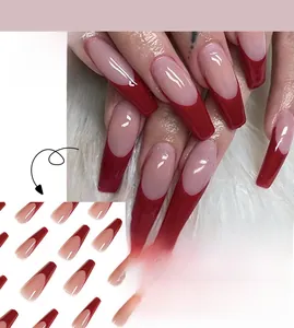 Detail of burgundy and nude French long coffin press-on nails with glossy finish