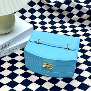 Close-up of blue multi-layer PU leather jewelry box with golden lock and three drawers