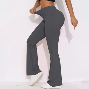 Detail shot of high-waisted dark grey yoga flare pants showing high elasticity fabric