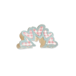 Pink checkered heart claw clip with light blue borders and clear beige teeth on white base