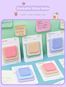 Three-in-one macaron sticky notes with tiered sizes on a mint green background