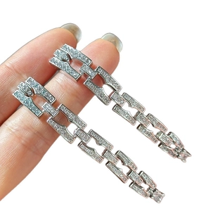 Elegant silver tassel earrings with cubic zirconia squares on a clean white background