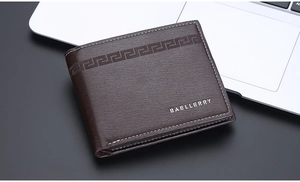 Detail of dark brown leather wallet showing embossed meander pattern and white stitching