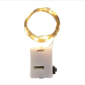 Detail of warm white LED copper wire fairy lights with a white rectangular battery box