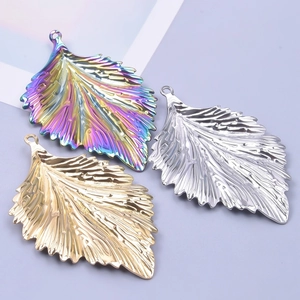 Detailed leaf-shaped stainless steel pendants in gold, silver and rainbow colors