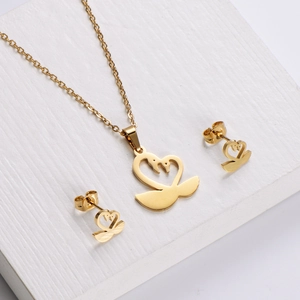 Golden stainless steel jewelry set featuring heart-shaped swan necklace and stud earrings