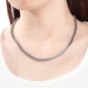 Polished stainless steel curb chain necklace for men and women worn on a white collar