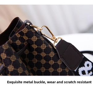 Macro view of vintage bucket bag with golden metal hardware and printed fabric strap