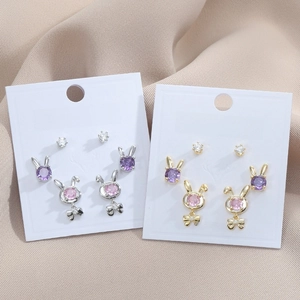 Detailed view of S925 silver rabbit earrings with pink purple gems and tiny bows