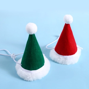 Macro detail of red and green felt pet Christmas hats with adjustable elastic straps
