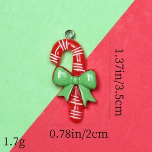 Detailed size view of red and white striped candy cane resin pendant with green bow