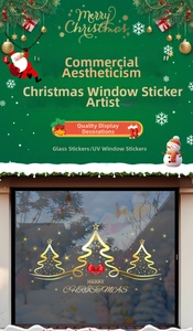 Detail of UV gold foil Christmas tree window stickers on glass storefront window