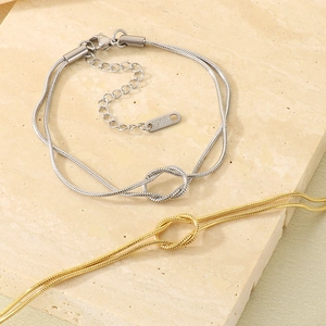 Minimalist stainless steel knot snake chain bracelet in gold and silver finishes
