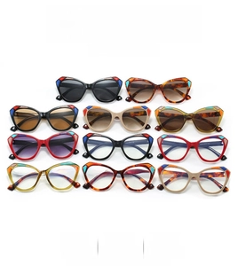Flat lay of retro cat eye sunglasses in eleven diverse colors and contrasting patterns