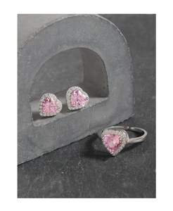 Detail of pink heart zircon jewelry set with micro-paved silver ring and earrings