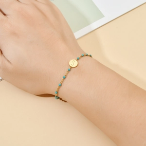 Bohemian gold stainless steel bracelet featuring turquoise beads and a Yin Yang pendant