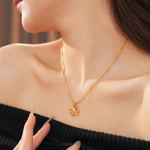 Exquisite gold pegasus pendant necklace with crystals worn on neck for a luxury look