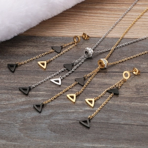 Golden and silver stainless steel jewelry set with triangle pendants and crystals