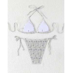 Detail of purple floral smocking fabric on triangle bikini set with neck tie straps