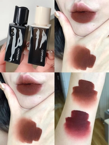 Detailed swatches of velvet matte lip glaze in dark reddish brown on lips and arm skin