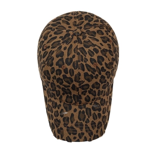 Distressed leopard print baseball cap with ripped brim detail and vintage streetwear style