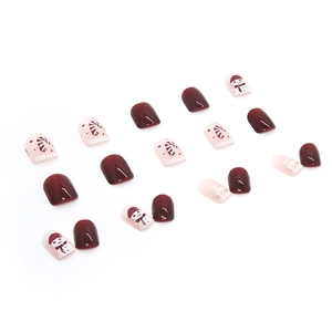 Short festive red Christmas press-on nails with cute snowman and glitter patterns