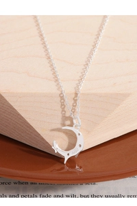 Macro view of S925 sterling silver crescent moon pendant with detailed texture