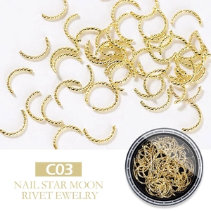 Macro shot of gold C-shaped metal nail art rivets for star and moon jewelry design