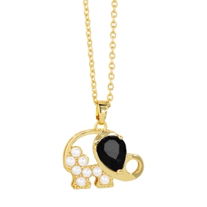 Detailed view of golden elephant necklace with white pearls and black teardrop gem
