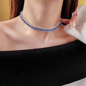 Close-up of luxury double-row blue and silver rhinestone choker on a model's neck