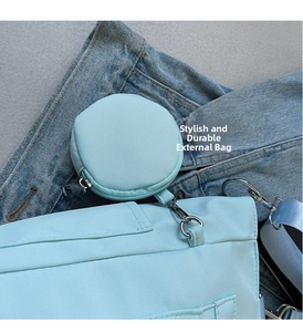 Detail view of light blue oxford tote bag with matching round hanging coin purse