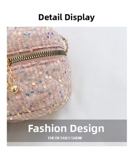 Close-up of pink sequin crossbody bag with quilted patterns and gold metal zipper detail