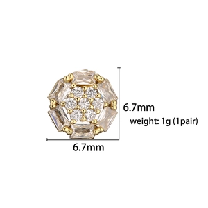 Macro shot showing 6.7mm diameter and 1g weight of gold cubic zirconia flower studs