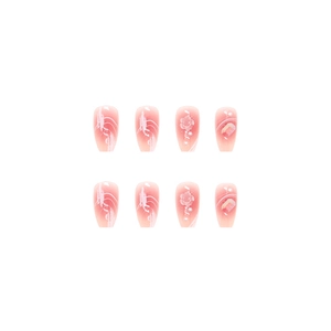 Pink gradient press-on nails with 3D embossed flowers, pearls, and aurora crystals