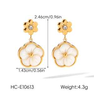 Detailed dimensions of white flower earrings with gold petals and clear stone center