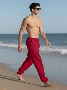 Men's red linen joggers featuring adjustable drawstring waist and comfortable beach style