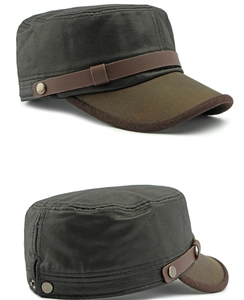 Detail view of cadet hat with grey fabric, brown brim, and retro metal rivet strap