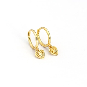 Polished gold minimalist hoop earrings featuring layered relief heart-shaped pendants