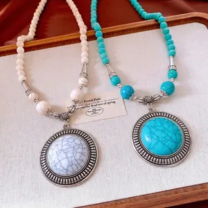 Vintage stone beaded necklace with round pendant in turquoise and white marble style