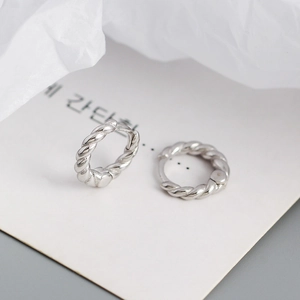 Close-up of S925 sterling silver hoop earrings with intricate twisted rope texture detail