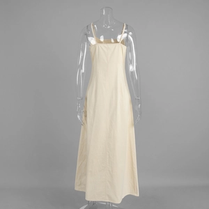 Detail of beige cotton-linen midi dress showing back view and natural fabric texture